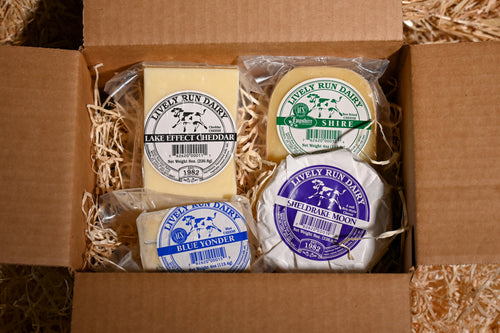 Cheese packaging with 'Lively Run Dairy' branding inside a cardboard box.